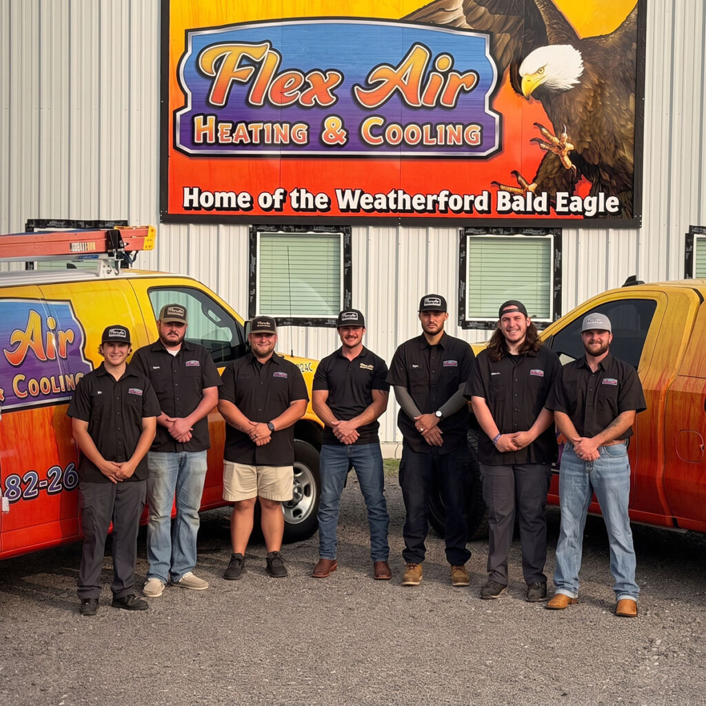 the flex air heating and cooling team lines up in front of their branded trucks and shop sign in weatherford, texas